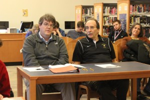 Schmid (left) with Jesse DiSabatino, former coach of Northwest High School, at a meet last year.